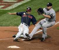 Grady Sizemore, de Cleveland, y Joba Chamberlain, de Nueva York